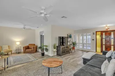 a living room with a couch and a table at MiaBella of Hollywood home in Hollywood