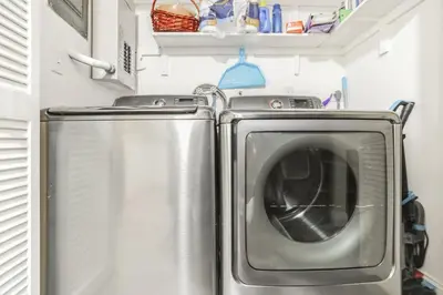 a washer and dryer in an rv at MiaBella of Hollywood home in Hollywood