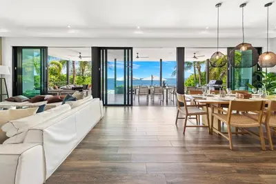 a living room with a white couch and a table at Best Bayfront View New construction w pool in Miami Beach