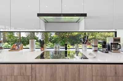 a kitchen with a counter top with a sink at Best Bayfront View New construction w pool in Miami Beach