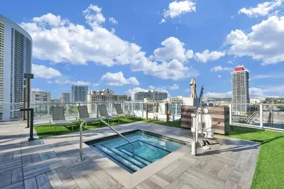 a swimming pool on the roof of a building at Oceanfront Condo Direct Ocean & Beach Club Access in Hollywood