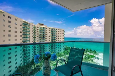 a balcony with a view of the ocean at Ocean View Modern Condo Beach Access 11M in Hollywood