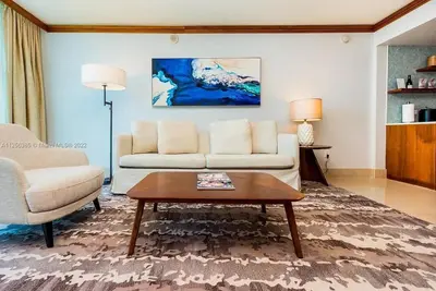 a living room with a couch and a coffee table at Ocean View Luxury Carillon Condo at Beach Access C616 in Miami Beach