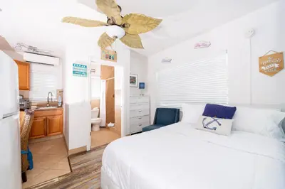 a bedroom with a bed and a ceiling fan at Tropic Isle Boutique Hotel in Hollywood