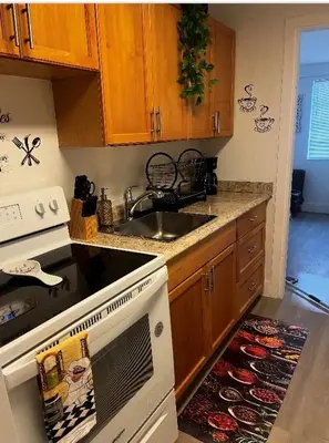 a kitchen with a sink and a stove at Home Sweet Home in Miami