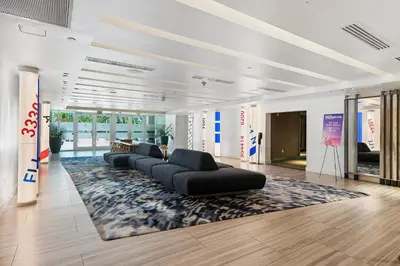 a living room with couches and a rug at Resort-Style Residence Beachfront Condo Oasis in Fort Lauderdale