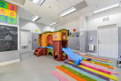 a childs play room with a slide and a playground at Stunning 1/1 Condo @Brickell Free Parking/Pool in Miami