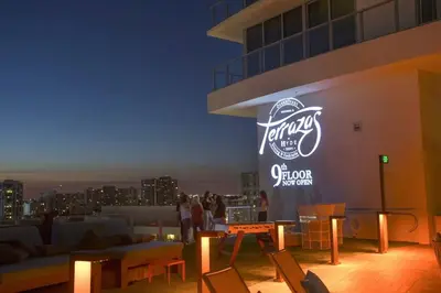 a sign on the side of a building with chairs at Direct Oceanfront Condo - Hyde Resort in Hollywood