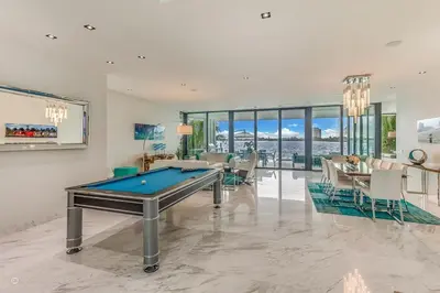 a living room with a pool table in it at Best Sunset Bayfront - pool jacuzzi pool table in Miami Beach