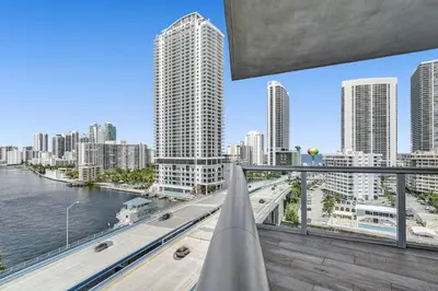a view of a city skyline from a balcony at Lovely 3 bedroom 3 bathroom ocean front in Hallandale Beach