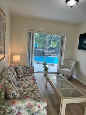 a living room with a couch and a glass table at Airbnb rental in Miami