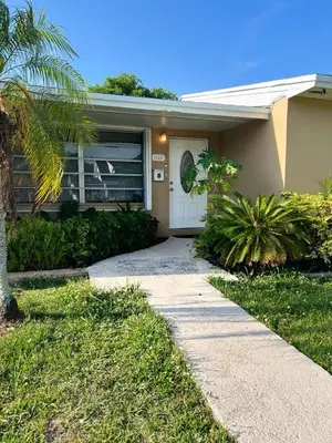 a house with a walkway leading to the front door at Airbnb rental in Miami