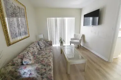 a living room with a couch and a table at Airbnb rental in Miami