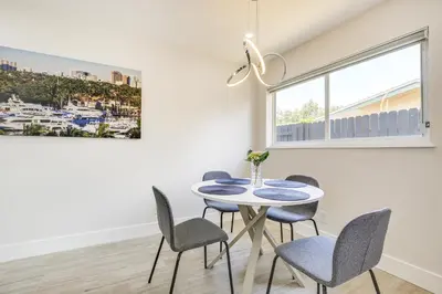 a dining room with a table and chairs at Fort Lauderdale Vacation Rental about 8 Mi to Beaches! in Fort Lauderdale