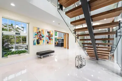 a staircase in a house with a living room at Modani Estates in Miami
