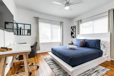 a bedroom with a blue bed and a desk and a desk at Comfy Little Havana Apt - Centrally located Hv2 in Miami