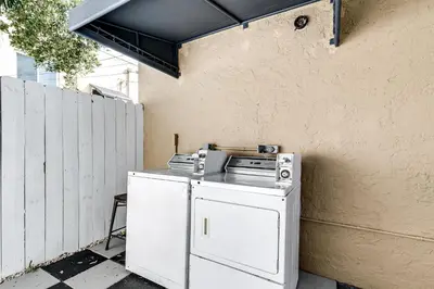 a white washer and dryer sitting next to a wall at Comfy Little Havana Apt - Centrally located Hv2 in Miami