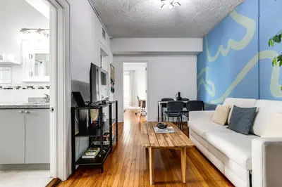 a living room with a white couch and a table at Comfy Little Havana Apt - Centrally located Hv2 in Miami