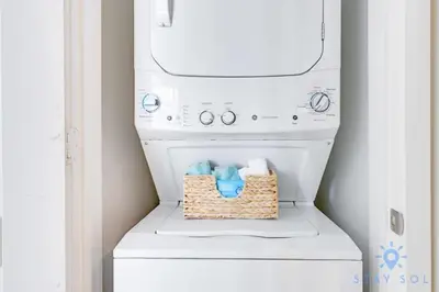 a laundry room with a washer and dryer at Rooftop Oceanview Balcony Beachfront Resort in Hollywood