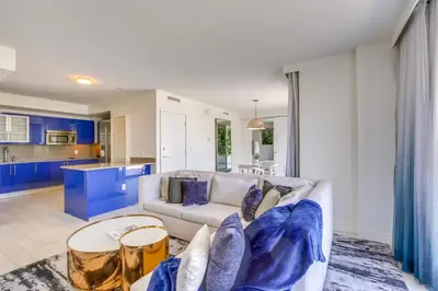 a living room with a couch and a table at Fort Lauderdale Condo with Veranda and Ocean View! in Fort Lauderdale