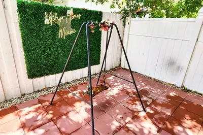 a pair of mowing poles in front of a hedge at Comfy & Updated Apartment centrally located minutes away from everything! in Miami