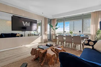 a living room with a tv and a dining room at 2-Story 3BD Brickell Penthouse Free Parking Heated Pool in Miami