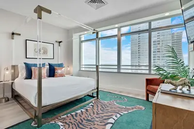 a bedroom with a bed and a zebra rug at 2-Story 3BD Brickell Penthouse Free Parking Heated Pool in Miami