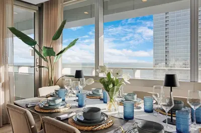 a dining room with a table with a view of the city at 2-Story 3BD Brickell Penthouse Free Parking Heated Pool in Miami