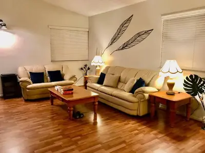 a living room with two couches and two tables at Pool House in Tropical Miami in Miami