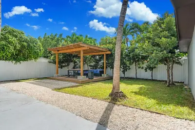 a picnic shelter in a yard with a fence at Villa Coco Cozy Home Near Brickell Miami Beach in Miami