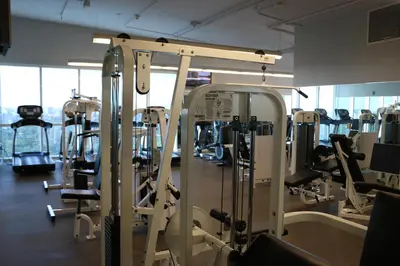 a gym with lots of treadmills and machines at Glamorous Bay View Studio In The Heart Of Grove in Miami