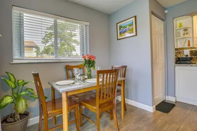 a dining room with a table and chairs and a window at Private Pool and Patio Fort Lauderdale Home! in Fort Lauderdale