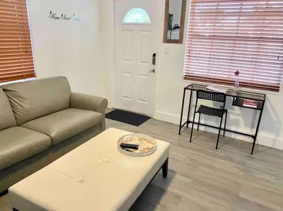 a living room with a couch and a coffee table at Home Sweet Home Near Malls and Airport and Hwy in South Miami
