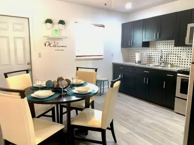 a kitchen and dining room with a table and chairs at Home Sweet Home Near Malls and Airport and Hwy in South Miami