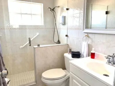 a bathroom with a toilet and a sink and a shower at Home Sweet Home Near Malls and Airport and Hwy in South Miami