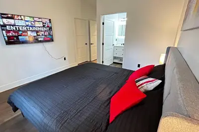 a bedroom with a large bed and a couch at Sunny Delight Home Near Airport in Hollywood