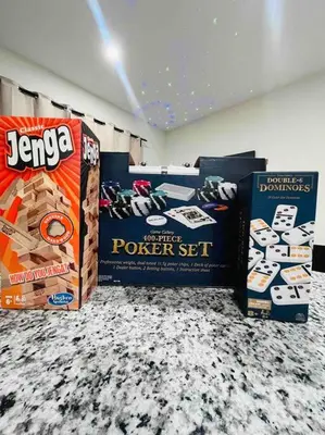 a room with boxes of poker set on a floor at Miami Luxury 5BD Home! Next to Wynwood & Design district in Miami
