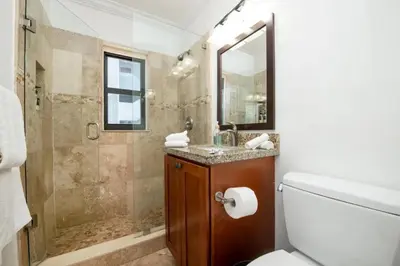 a bathroom with a toilet and a sink and a shower at 311-22 Beachside in Hollywood