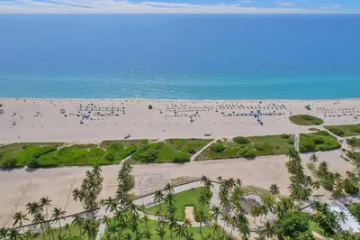 an aerial view of a beach with a lot of people at SOBE Monarch 1 - 2 BEDROOM 2 BATHROOM - MODERN APTS -WALK TO OCEAN DRIVE -2 INDEPENDENT 1 BEDROOM 1 BATHROOM APTS in Miami Beach
