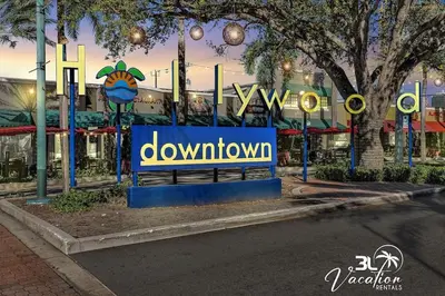 a sign in front of a downtown sign on a street at Luxury Hollywood Home, Heated Pool, Casino Nearby in Hollywood