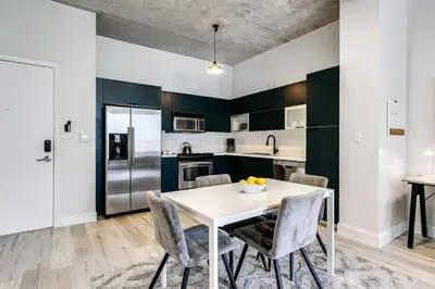 a kitchen with a white table and chairs at Contemporary Loft in Beautiful Down 4 people 1608 in Miami