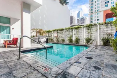 a swimming pool on the side of a building at Contemporary Loft in Beautiful Down 4 people 1608 in Miami