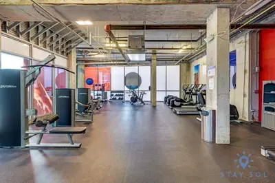 a gym with lots of treadmills and cardio machines at Cozy Apartment - Hollywood Beach - Amazing Pool in Hollywood