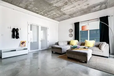 a living room with a couch and a chair at Spectacular 2-Br Apartment 4 people 1107 in Miami