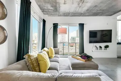 a living room with two couches and a tv at Spectacular 2-Br Apartment 4 people 1107 in Miami