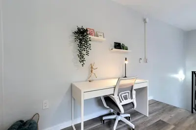 an office with a desk and two chairs at Loft style 1b Apt , Fast Wi-Fi Virg14 in Miami
