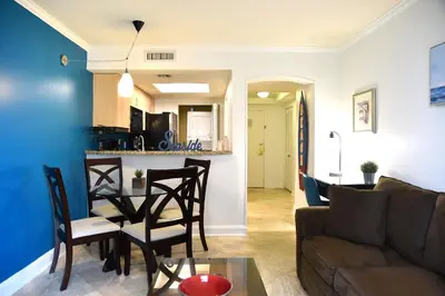a living room with a couch and a table at Relaxing Condo Hotel In The Grove, Free Parking in Miami