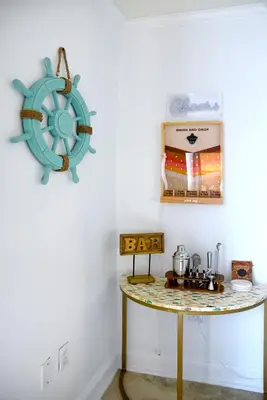 a room with a table with a steering wheel on the wall at Relaxing Condo Hotel In The Grove, Free Parking in Miami