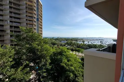 a view of the water from a balcony of a building at Relaxing Condo Hotel In The Grove, Free Parking in Miami