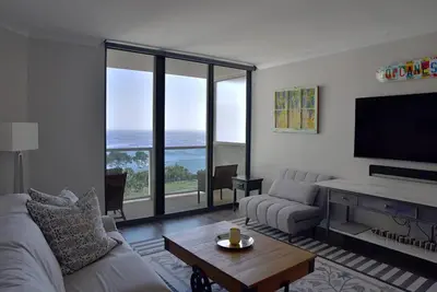 a living room with a couch and a tv at Sight Of Sail Boats! Tranquil 115 Coconut Grove in Miami
